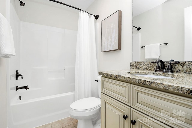 bathroom featuring shower / bath combination with curtain, tile patterned flooring, vanity, and toilet