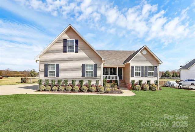 traditional-style home featuring a porch and a front lawn