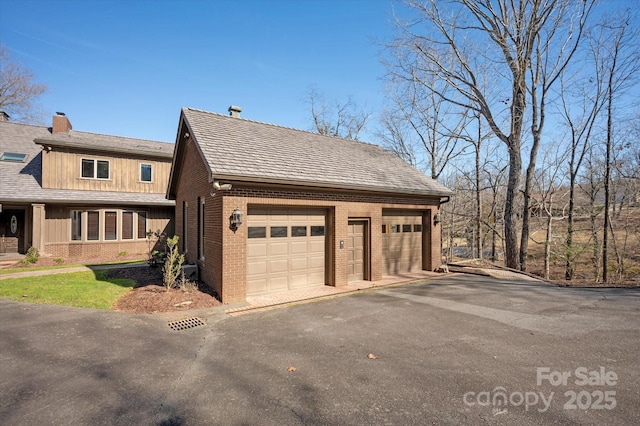 garage featuring driveway