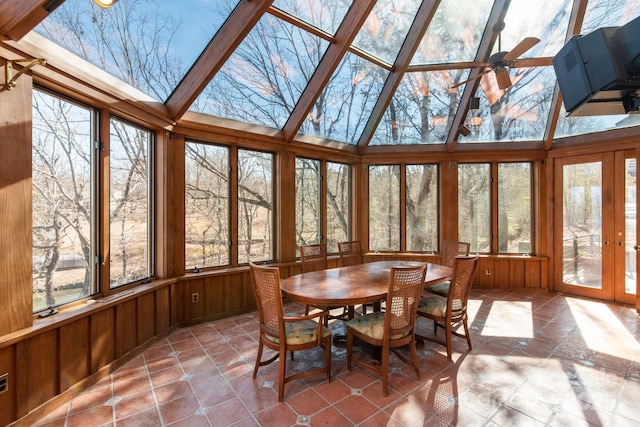 sunroom featuring a healthy amount of sunlight, ceiling fan, and french doors