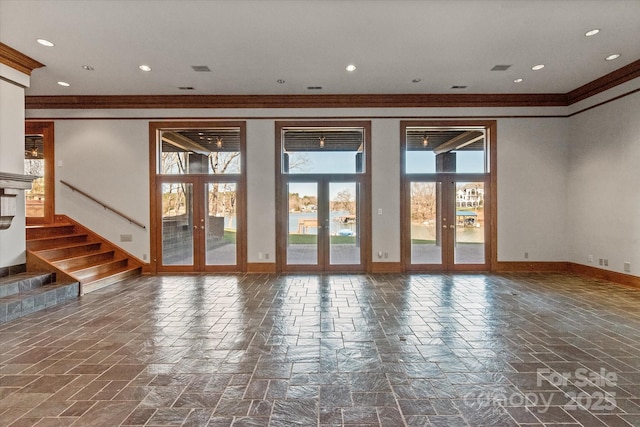 empty room featuring recessed lighting, baseboards, french doors, stairway, and crown molding