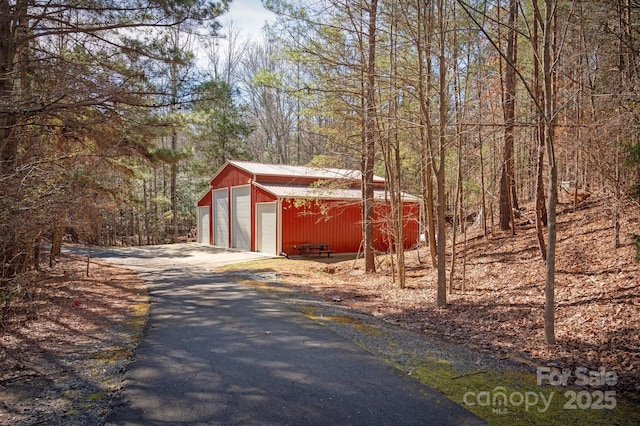 view of street featuring aphalt driveway