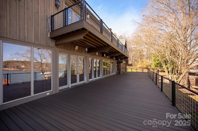 wooden deck with a water view