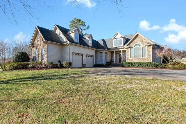 view of front of house with a garage and a front yard