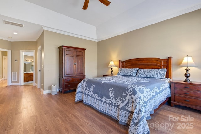 bedroom with crown molding, hardwood / wood-style flooring, and ceiling fan