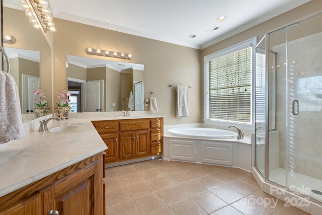 bathroom with ornamental molding, vanity, separate shower and tub, and tile patterned floors