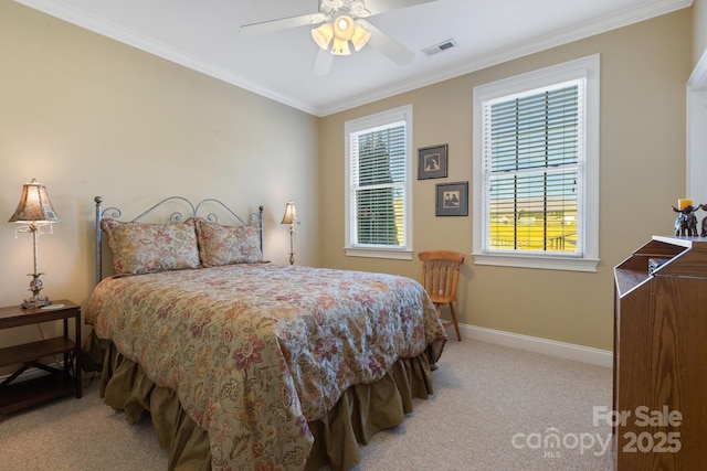 carpeted bedroom with crown molding and ceiling fan