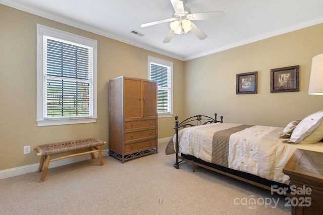 carpeted bedroom featuring multiple windows, ornamental molding, and ceiling fan