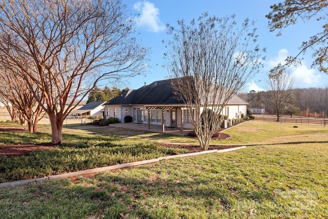 exterior space with a front yard and a patio