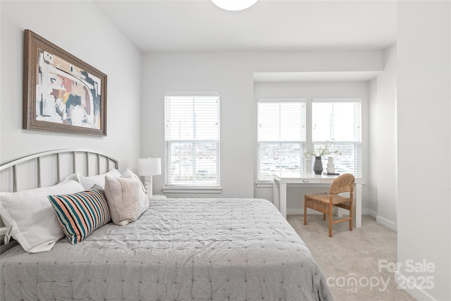 bedroom featuring light carpet