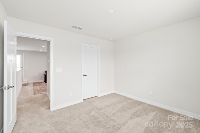 unfurnished bedroom with light carpet