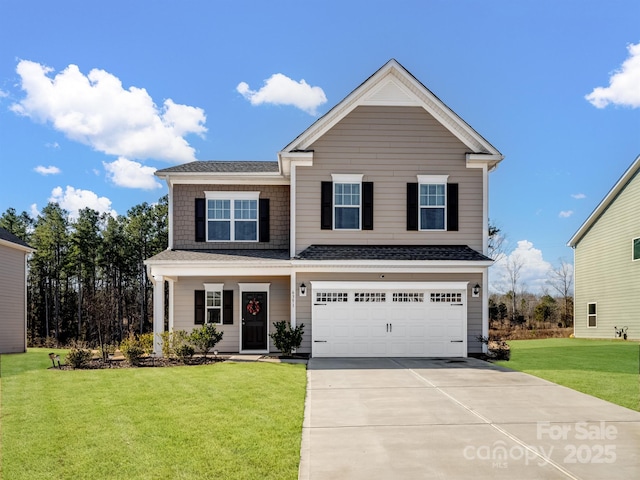 view of front property with a garage and a front lawn