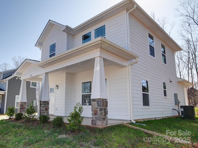 view of front of home with central AC unit and covered porch