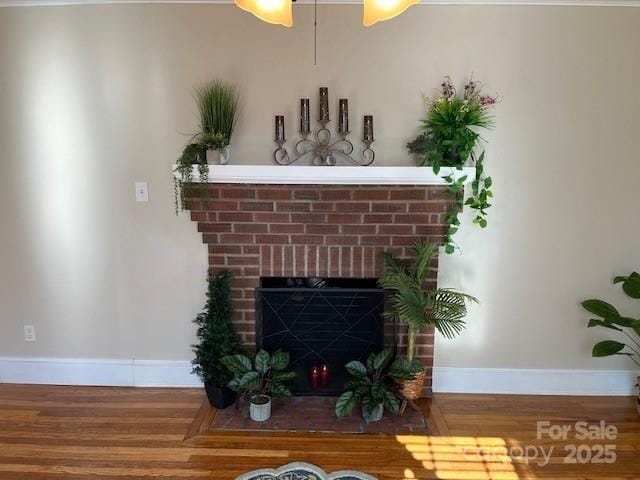 interior details with hardwood / wood-style flooring and a fireplace