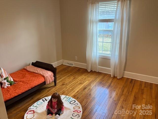 bedroom featuring hardwood / wood-style flooring