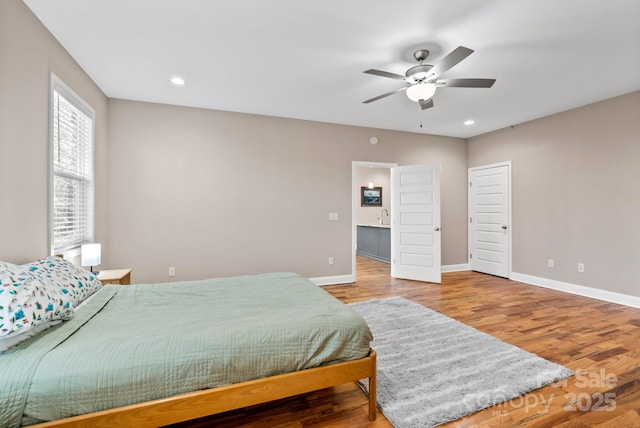 bedroom featuring wood-type flooring and ceiling fan