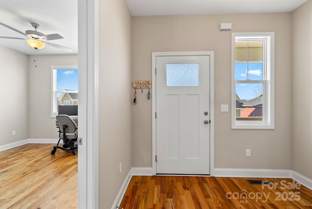 entryway with ceiling fan and light wood-type flooring
