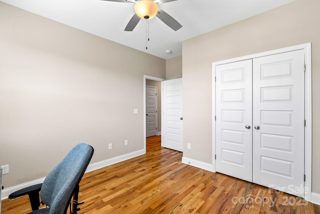 office space with wood-type flooring and ceiling fan
