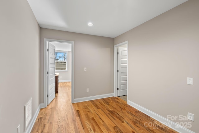 unfurnished room featuring light wood-type flooring