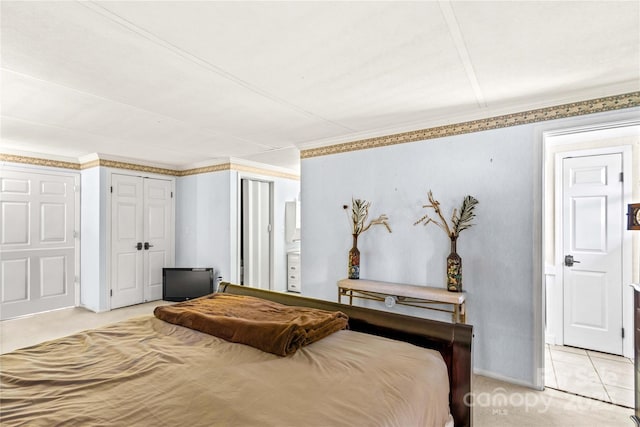 carpeted bedroom featuring crown molding