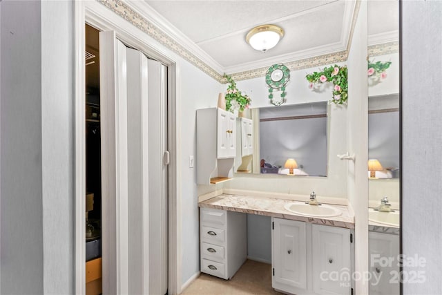 bathroom with vanity and crown molding