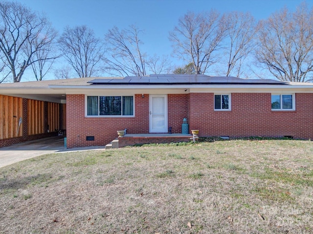 ranch-style house with a carport and a front yard