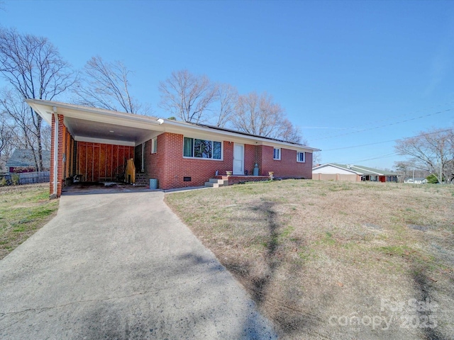 ranch-style home with a front lawn and a carport