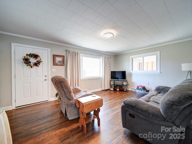 living room with crown molding and dark hardwood / wood-style floors