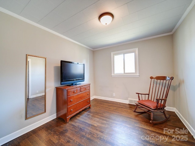 sitting room with crown molding and dark hardwood / wood-style flooring