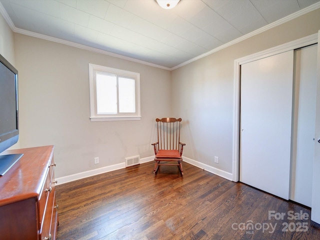 unfurnished room with crown molding and dark wood-type flooring