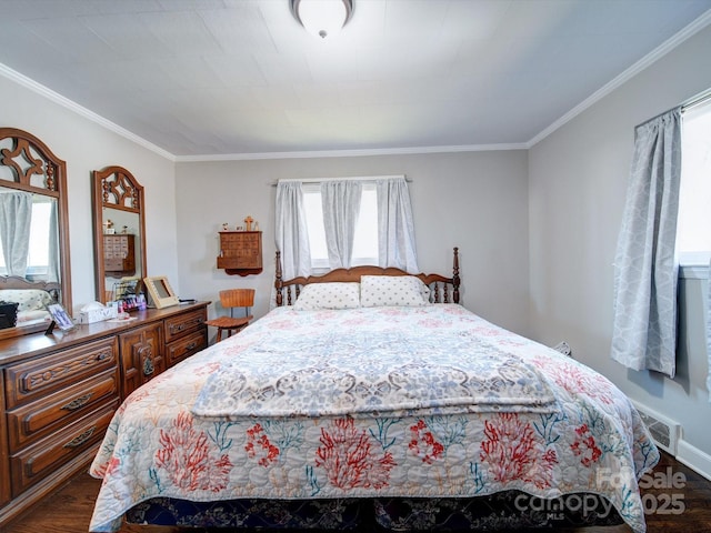 bedroom with crown molding and dark wood-type flooring