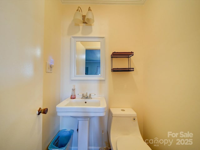 bathroom with toilet and sink