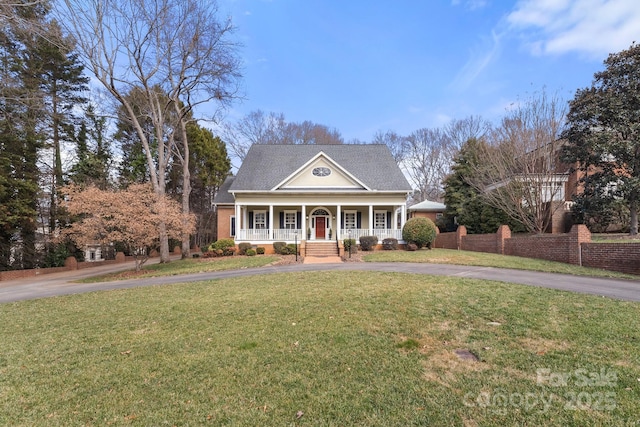 view of front facade with a porch and a front yard