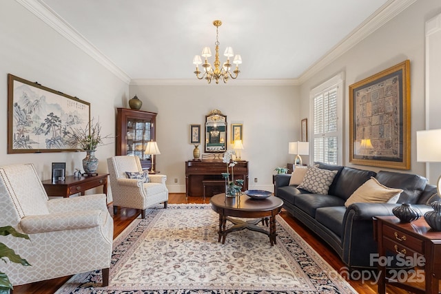 living room with wood-type flooring, an inviting chandelier, and crown molding