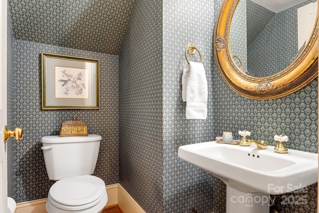 bathroom featuring sink and toilet