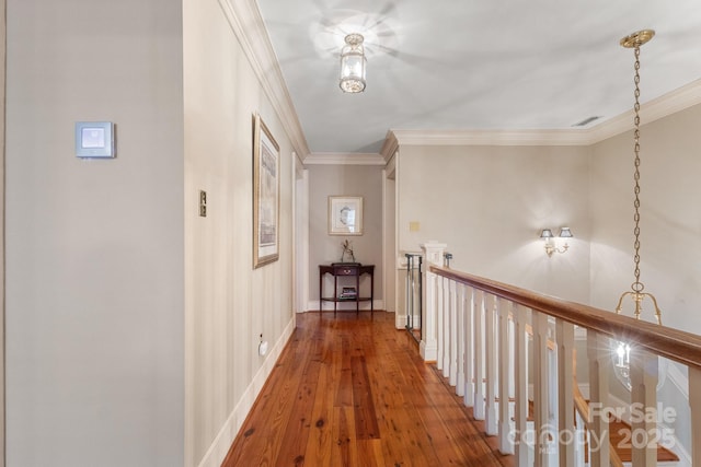 hallway featuring crown molding and hardwood / wood-style floors