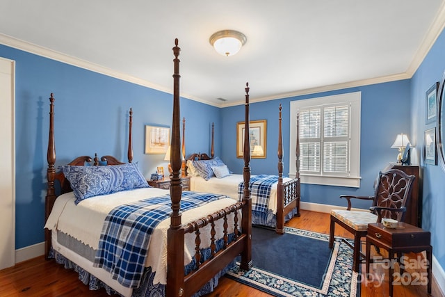 bedroom featuring wood-type flooring and crown molding