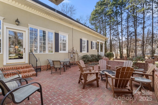 view of patio / terrace featuring an outdoor fire pit