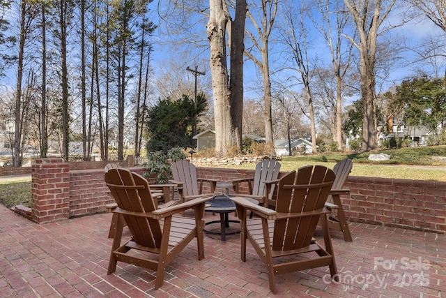 view of patio featuring an outdoor fire pit