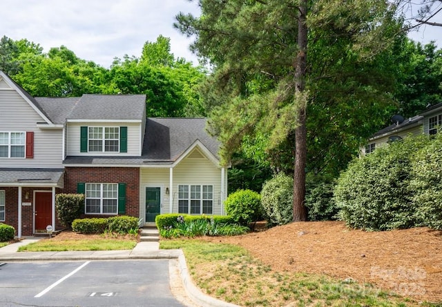 1748 Pergola Pl, Charlotte, NC 28213 - view of front of home featuring brick siding, a shingled roof, and uncovered parking