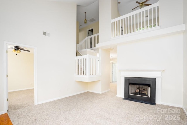 1748 Pergola Pl, Charlotte, NC 28213 - unfurnished living room with high vaulted ceiling, ceiling fan, carpet, and visible vents