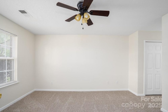 1748 Pergola Pl, Charlotte, NC 28213 - unfurnished room with a ceiling fan, baseboards, visible vents, and light carpet