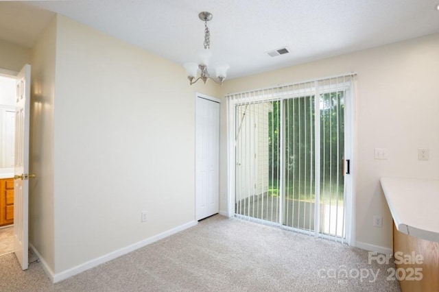 1748 Pergola Pl, Charlotte, NC 28213 - empty room with light colored carpet, baseboards, and a chandelier