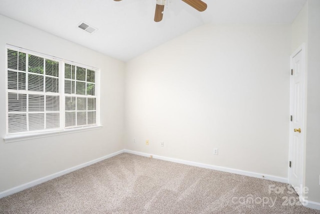 1748 Pergola Pl, Charlotte, NC 28213 - empty room featuring carpet flooring, a ceiling fan, baseboards, vaulted ceiling, and visible vents