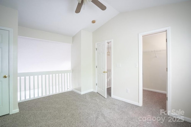 1748 Pergola Pl, Charlotte, NC 28213 - unfurnished bedroom with vaulted ceiling, a walk in closet, carpet, and a closet