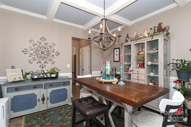 dining space with dark hardwood / wood-style floors, a chandelier, ornamental molding, coffered ceiling, and beam ceiling