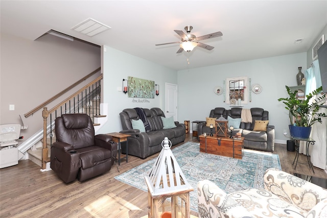 living room with hardwood / wood-style floors and ceiling fan