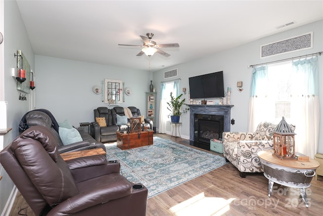 living room featuring hardwood / wood-style flooring and ceiling fan