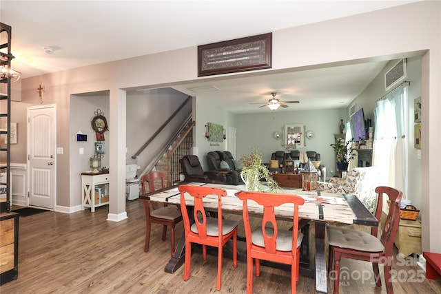 dining room with hardwood / wood-style flooring and ceiling fan