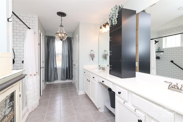 bathroom featuring vanity, a wealth of natural light, and tile patterned floors